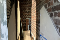 Interior of stairwell with staircase removed, viewing the second floor landing