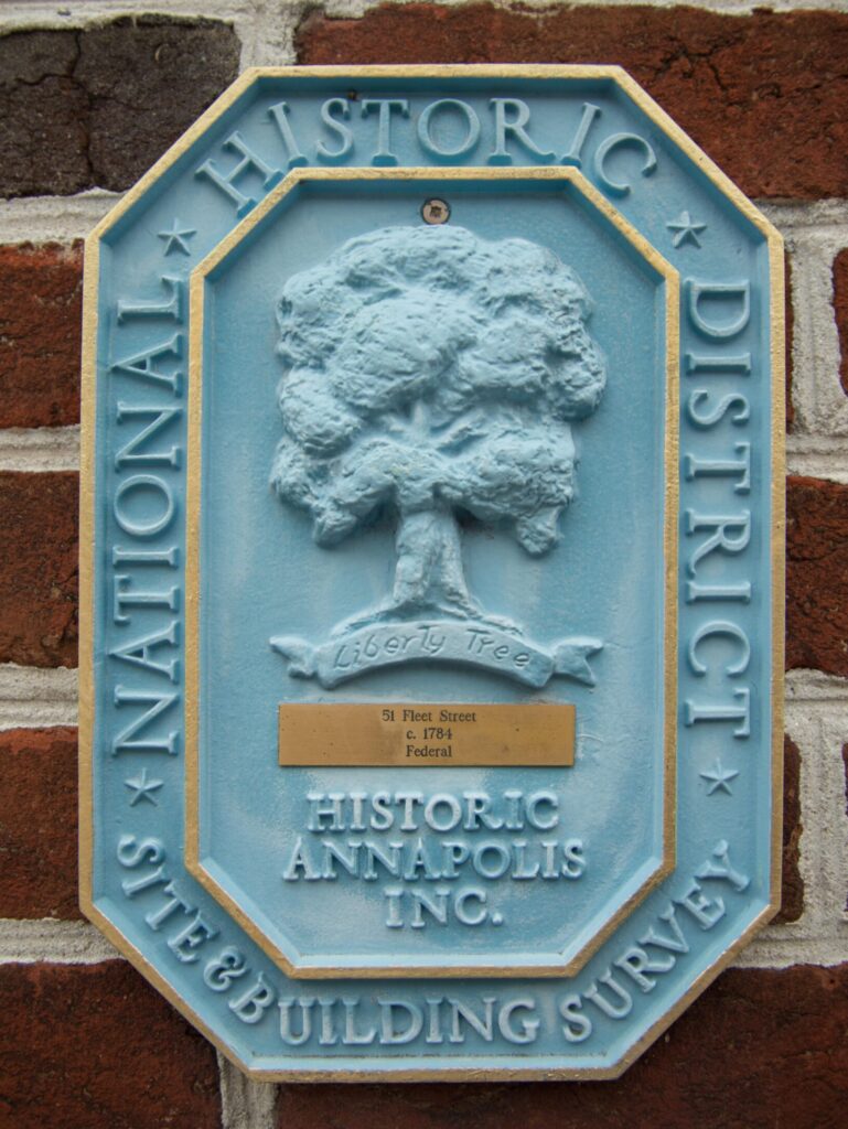 Blue Historic Marker mounted on a Federal-style building, highlighting the elegant design and preservation of early 19th-century Annapolis homes.