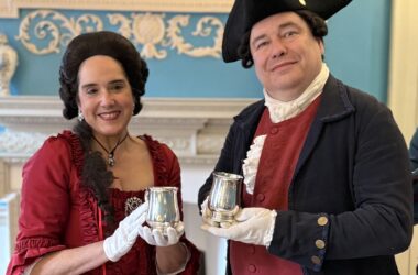 Costumed interpreters dressed in colonial attire welcome visitors at the William Paca House during a living history event in Annapolis.