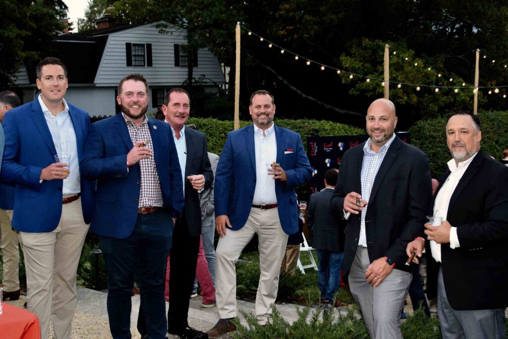 Guests gather at the Blazers. Bourbon. Cigars. event hosted by Historic Annapolis at the William Paca House & Garden, an exclusive evening of bourbon tastings and networking with premier sponsorship opportunities