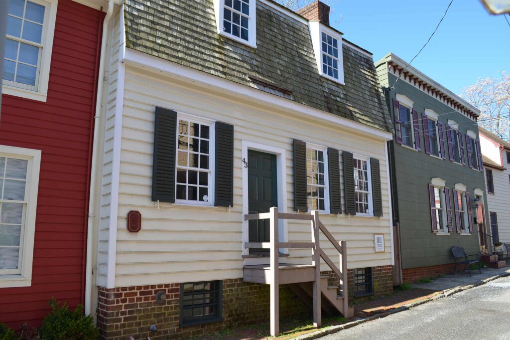 Costumed interpreters demonstrating 18th-century crafts at the Hogshead Trades Museum in Annapolis, a living history site operated by Historic Annapolis.