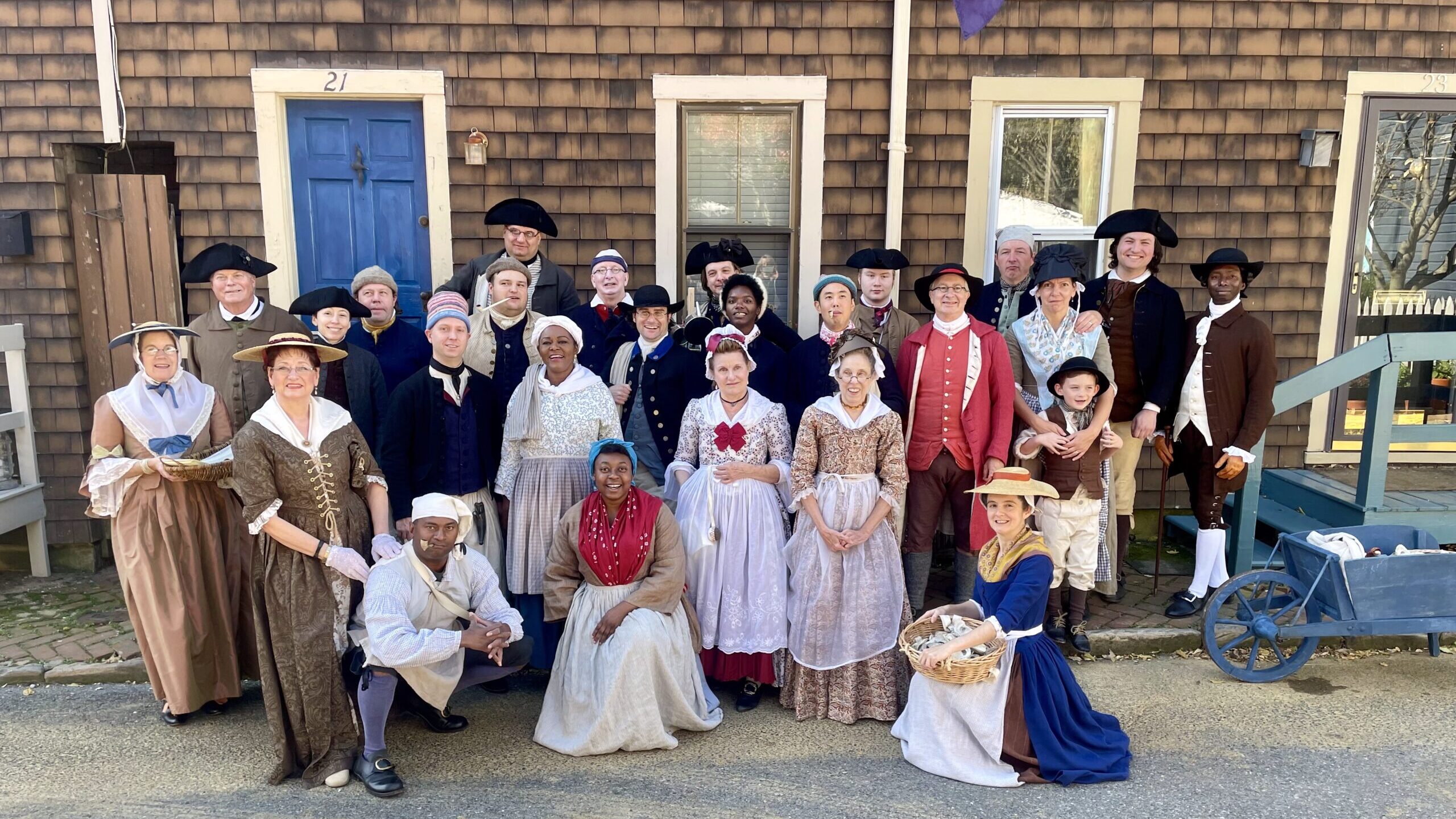 Group of living historians dressed in 18th-century attire portraying Annapolis residents during the Peggy Stewart 250th anniversary celebration, part of Historic Annapolis’s living history program.