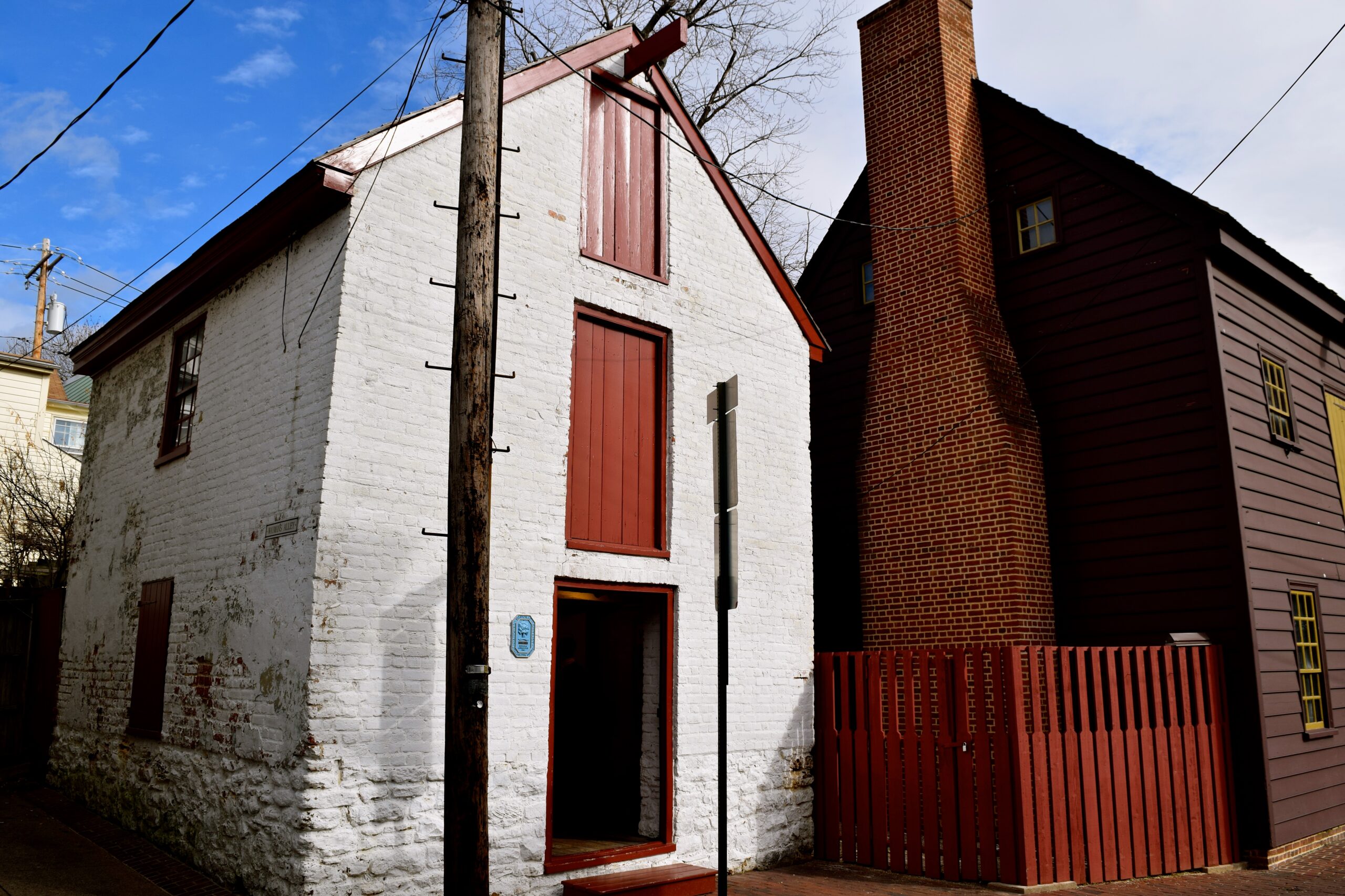 Interior view of the Waterfront Warehouse on Pinkney Street, featuring exhibits on 18th-century maritime trade and a detailed model of historic Annapolis.