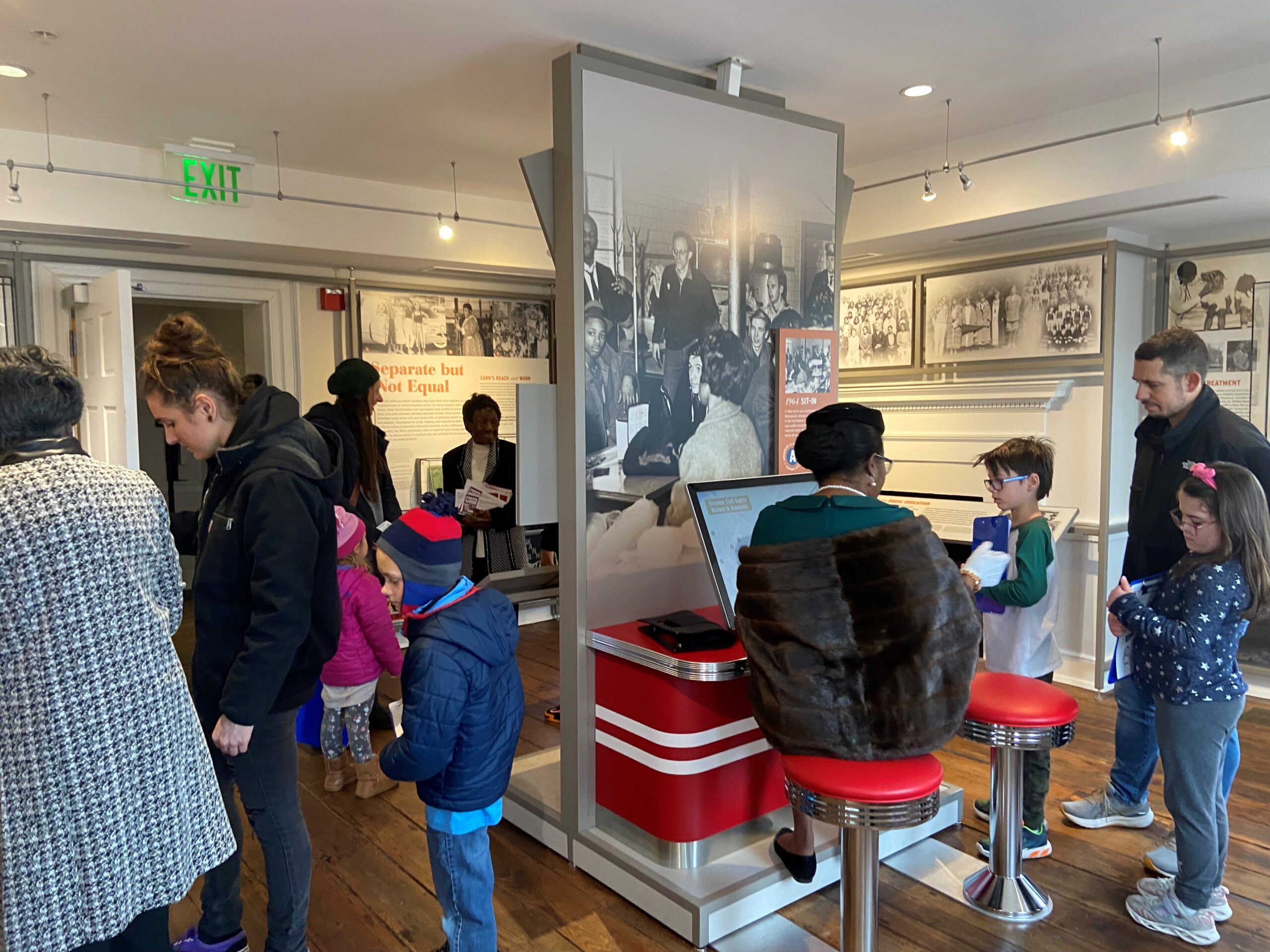 A group of people explore museum exhibits