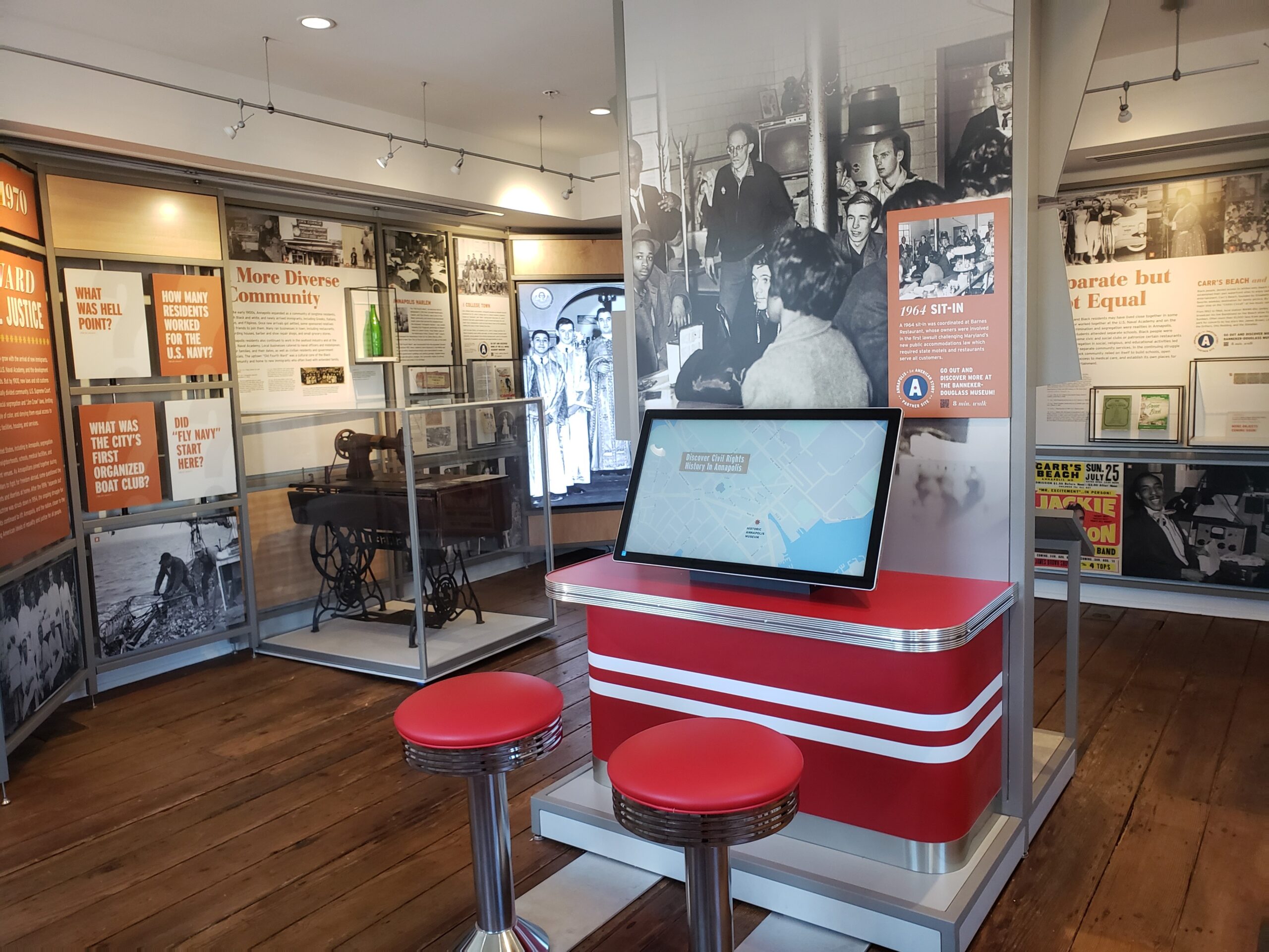 Interactive touchscreen display at the Museum of Historic Annapolis engaging visitors with multimedia stories from Annapolis’s 400-year history.