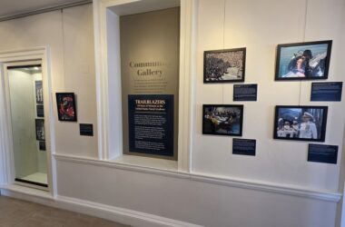 A gallery display of photos in a museum.