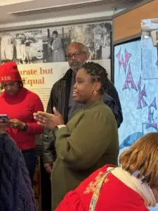 A tour guide gives a tour in a museum.