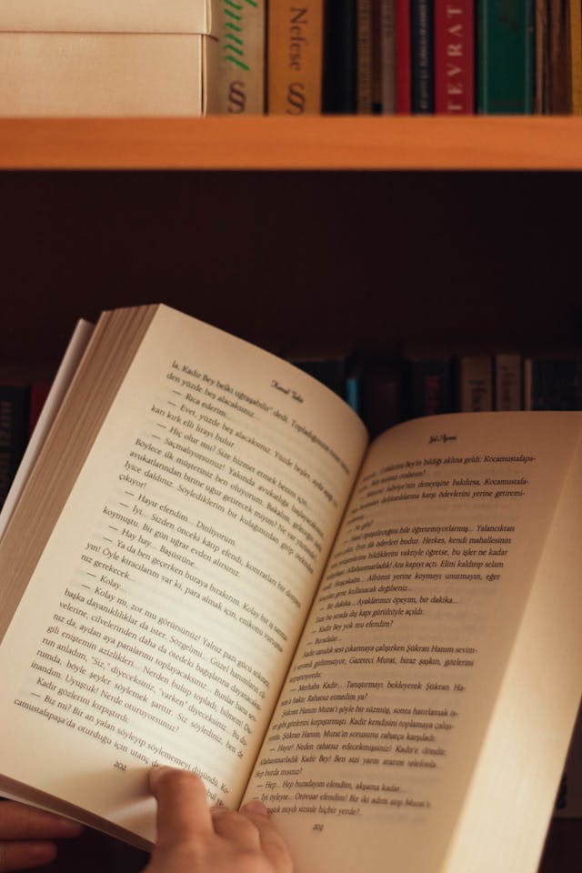 A person holding and reading a book