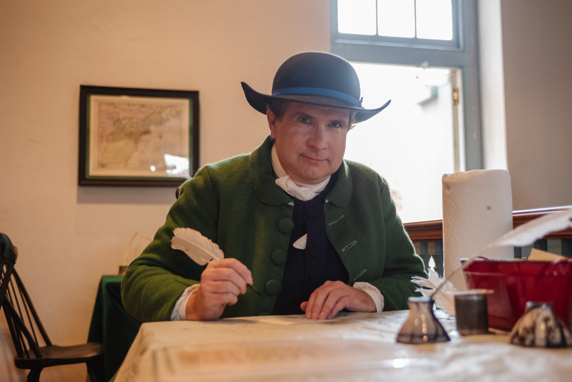 Living historian Sean Lowman dressed as a colonial tailor