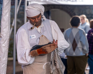 Reenactor portraying a colonial-era cobbler