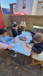 Children doing a colonial-era craft