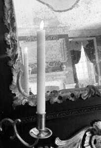 black and white photo of a candle