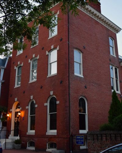 A historic brick building at twilight