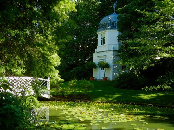 The domed Summerhouse reflected in the fish-shaped pond at the William Paca Garden, a picturesque landmark in historic Annapolis.
